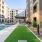 Outdoor lounge at Cadence at Frisco Station apartments in Frisco, TX, featuring astroturf and outdoor seating.